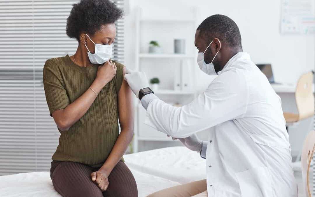 A woman sits calmly at the clinic as she gets her first dose of Xolair for allergies.