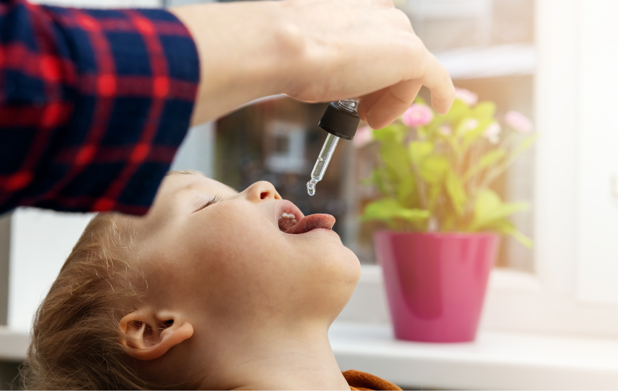 After consulting with Dr. Jantzi, a child is consistently taking his allergy drops as part of his mold allergy treatment.